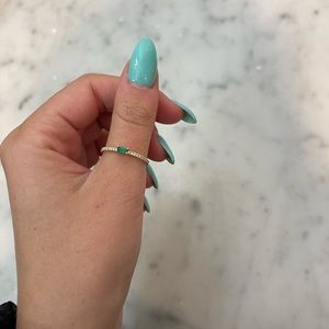 Emerald baguette ring with diamonds